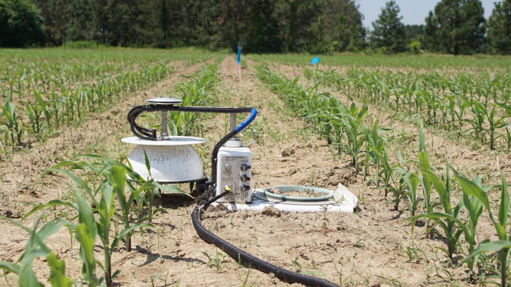 soil emissions device in a corn field